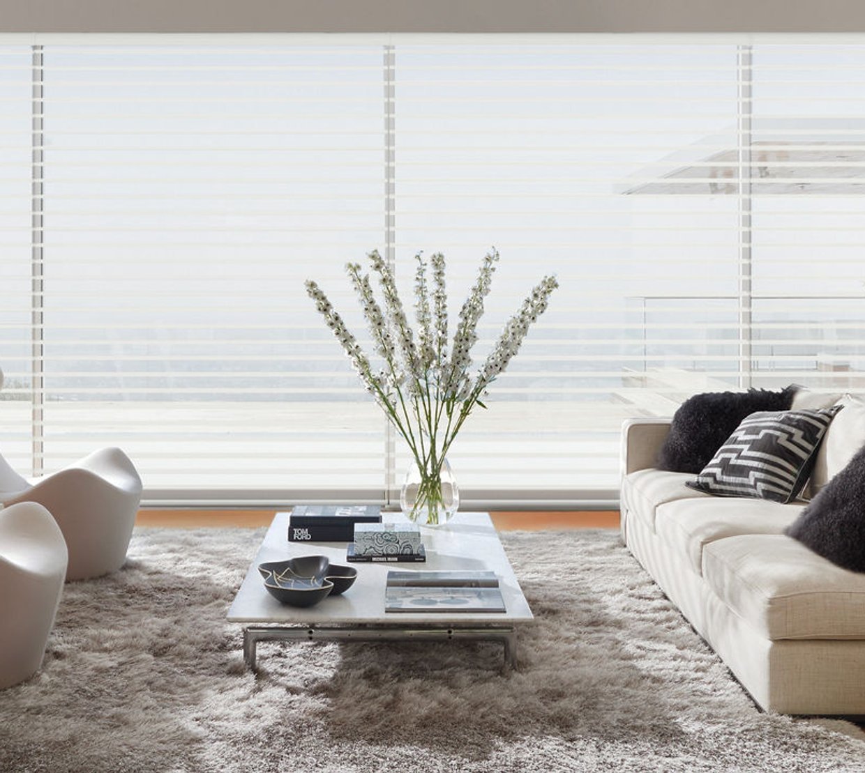Sheer shades filtering light into a calm living room